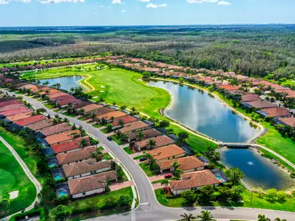 Bonita National golf community with red-tile roofs and ponds from the air